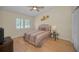 Comfortable bedroom featuring a ceiling fan, closet, and bright natural light at 3079 Landmark Blvd # 1608, Palm Harbor, FL 34684
