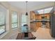 Charming breakfast nook with modern pendant lighting and stainless steel appliances at 3079 Landmark Blvd # 1608, Palm Harbor, FL 34684