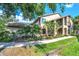 Inviting two-story home with well-maintained landscaping and a welcoming walkway at 3079 Landmark Blvd # 1608, Palm Harbor, FL 34684
