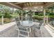 Picturesque gazebo overlooking a serene pond with fountain feature, ideal for relaxing or enjoying the view at 3079 Landmark Blvd # 1608, Palm Harbor, FL 34684