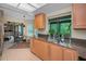 Bright kitchen area features granite countertops, garden window and breakfast nook at 3079 Landmark Blvd # 1608, Palm Harbor, FL 34684