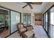 Relaxing sunroom featuring tile floor, wicker furniture, and a charming built-in counter at 3079 Landmark Blvd # 1608, Palm Harbor, FL 34684