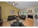 Cozy living room with fireplace, hardwood floors, and comfortable seating area at 3079 Landmark Blvd # 1608, Palm Harbor, FL 34684