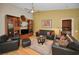 Comfortable living room featuring plush leather furniture and stylish decor at 3079 Landmark Blvd # 1608, Palm Harbor, FL 34684