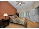 Comfortable main bedroom with a ceiling fan, ensuite and plenty of natural light at 3079 Landmark Blvd # 1608, Palm Harbor, FL 34684