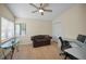 Cozy home office with a large window, ceiling fan, and dedicated workspace at 3079 Landmark Blvd # 1608, Palm Harbor, FL 34684