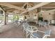 Charming shaded pavilion at community pool, furnished with tables and chairs, perfect for gatherings at 3079 Landmark Blvd # 1608, Palm Harbor, FL 34684