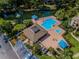 Stunning aerial view of the community pool area, complete with a covered pavilion and relaxing spa at 3079 Landmark Blvd # 1608, Palm Harbor, FL 34684