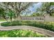 Landmark Oaks community entrance sign surrounded by lush greenery, inviting and well-maintained at 3079 Landmark Blvd # 1608, Palm Harbor, FL 34684