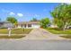 Front exterior view of the house features an attached garage and a well-manicured front lawn at 3123 Laird Dr, New Port Richey, FL 34655
