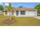 Charming single-story home with a well-maintained lawn and a decorative stucco exterior at 3123 Laird Dr, New Port Richey, FL 34655
