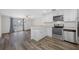 Bright kitchen featuring stainless steel appliances, granite countertops, and modern fixtures at 3123 Laird Dr, New Port Richey, FL 34655