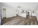 Open-concept living area includes a kitchen with stainless appliances and access to other rooms at 3123 Laird Dr, New Port Richey, FL 34655