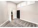 Spacious bedroom featuring plush gray carpeting, an open doorway, and plenty of built-in storage space at 3268 Tanglewood Trl, Palm Harbor, FL 34685