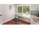 Cozy breakfast nook with a table and chairs next to a bright window at 3268 Tanglewood Trl, Palm Harbor, FL 34685