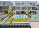Expansive backyard oasis with a pool, outdoor seating, fire pit, and scenic waterfront views at 344 Capri Blvd, Treasure Island, FL 33706