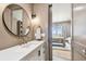 Modern bathroom with a vessel sink, gold-tone faucet, and a view into the bedroom at 344 Capri Blvd, Treasure Island, FL 33706