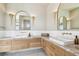 Dual sink bathroom vanity with marble countertop, gold fixtures, and ample drawer space at 344 Capri Blvd, Treasure Island, FL 33706