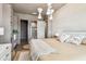 Bedroom featuring modern lighting fixture, ensuite bathroom, and neutral color palette at 344 Capri Blvd, Treasure Island, FL 33706