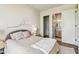 Relaxing bedroom features a cozy bed, ensuite bathroom, and large closet at 344 Capri Blvd, Treasure Island, FL 33706