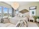 Serene bedroom with water views, plush sofa, and stylish decor, creating a tranquil retreat for relaxation and rest at 344 Capri Blvd, Treasure Island, FL 33706