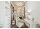 Bright walk-in closet boasts hardwood floors, recessed lighting, custom shelving, and a vanity at 344 Capri Blvd, Treasure Island, FL 33706