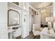 Spacious walk-in closet features recessed lighting, custom shelving, a vanity, and a cozy sitting area at 344 Capri Blvd, Treasure Island, FL 33706
