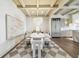 Open concept dining room with modern light fixtures and a bold textured art piece at 344 Capri Blvd, Treasure Island, FL 33706