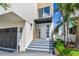 Inviting entrance featuring a modern door, elegant steps, and a well-maintained, landscaped walkway at 344 Capri Blvd, Treasure Island, FL 33706