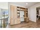 Bright hallway showcases custom built-in shelving, storage, and desk, blending functionality with stylish design elements at 344 Capri Blvd, Treasure Island, FL 33706