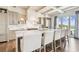 Bright kitchen features a large marble island, modern appliances, and seamless access to outdoor water views at 344 Capri Blvd, Treasure Island, FL 33706