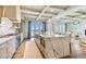 Spacious kitchen with marble island, modern appliances, and seamless flow to the living area and waterfront views at 344 Capri Blvd, Treasure Island, FL 33706