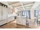 Open kitchen with a large island, marble countertops, modern appliances, and scenic waterfront views at 344 Capri Blvd, Treasure Island, FL 33706