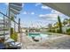 Beautiful waterfront pool and patio with a spiral staircase leading to a higher floor offering water views at 344 Capri Blvd, Treasure Island, FL 33706