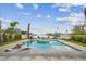 Backyard pool features a spa and beautiful waterfront views of the channel and neighboring docks at 344 Capri Blvd, Treasure Island, FL 33706