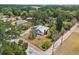 Aerial view of a single-Gathering home in a tree-filled neighborhood at 3614 Fortner Rd, Plant City, FL 33567
