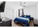 Comfortable bedroom featuring a ceiling fan, closet, and modern decor at 3801 Carroway St, Tampa, FL 33619