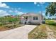 Home with welcoming front porch, and ample parking, perfect for enjoying the neighborhood views at 3801 Carroway St, Tampa, FL 33619