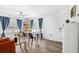 Open-concept living and dining area with lots of natural light, modern decor, and an inviting, cohesive design at 3801 Carroway St, Tampa, FL 33619