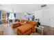 Bright living room seamlessly connects to the modern kitchen, creating a spacious and inviting open-concept living space at 3801 Carroway St, Tampa, FL 33619