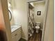 Bathroom showcasing a vanity with a sink and a toilet with a shower curtain at 38225 Ironwood Pl # 38225, Zephyrhills, FL 33542