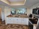 Bright kitchen featuring granite counters, stainless appliances, and an open view to the living area at 38225 Ironwood Pl # 38225, Zephyrhills, FL 33542