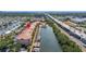 Aerial view of condo building with waterway, marina and highway at 5000 Culbreath Key Way # 8-319, Tampa, FL 33611