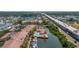 An aerial view shows condo community next to highway, pool and boats at 5000 Culbreath Key Way # 8-319, Tampa, FL 33611