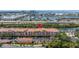 Aerial view of condo building on the water with a marina, red map pin, and waterway view at 5000 Culbreath Key Way # 8-319, Tampa, FL 33611