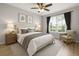 Comfortable bedroom featuring neutral tones, a ceiling fan, and plenty of natural light at 5000 Culbreath Key Way # 8-319, Tampa, FL 33611