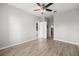 This light and airy bedroom features wood-look floors and entry to the bath and kitchen at 5000 Culbreath Key Way # 8-319, Tampa, FL 33611