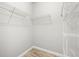 This walk-in closet has white wire shelving and wood-look flooring at 5000 Culbreath Key Way # 8-319, Tampa, FL 33611