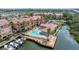 Condos featuring a waterfront pool, sun deck, and boat dock with easy access to the canal at 5000 Culbreath Key Way # 8-319, Tampa, FL 33611