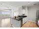 Open kitchen featuring sleek countertops, white cabinetry, and stainless steel appliances at 5000 Culbreath Key Way # 8-319, Tampa, FL 33611